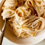 One big bowl of fettuccine alfredo recipe with a fork in it.