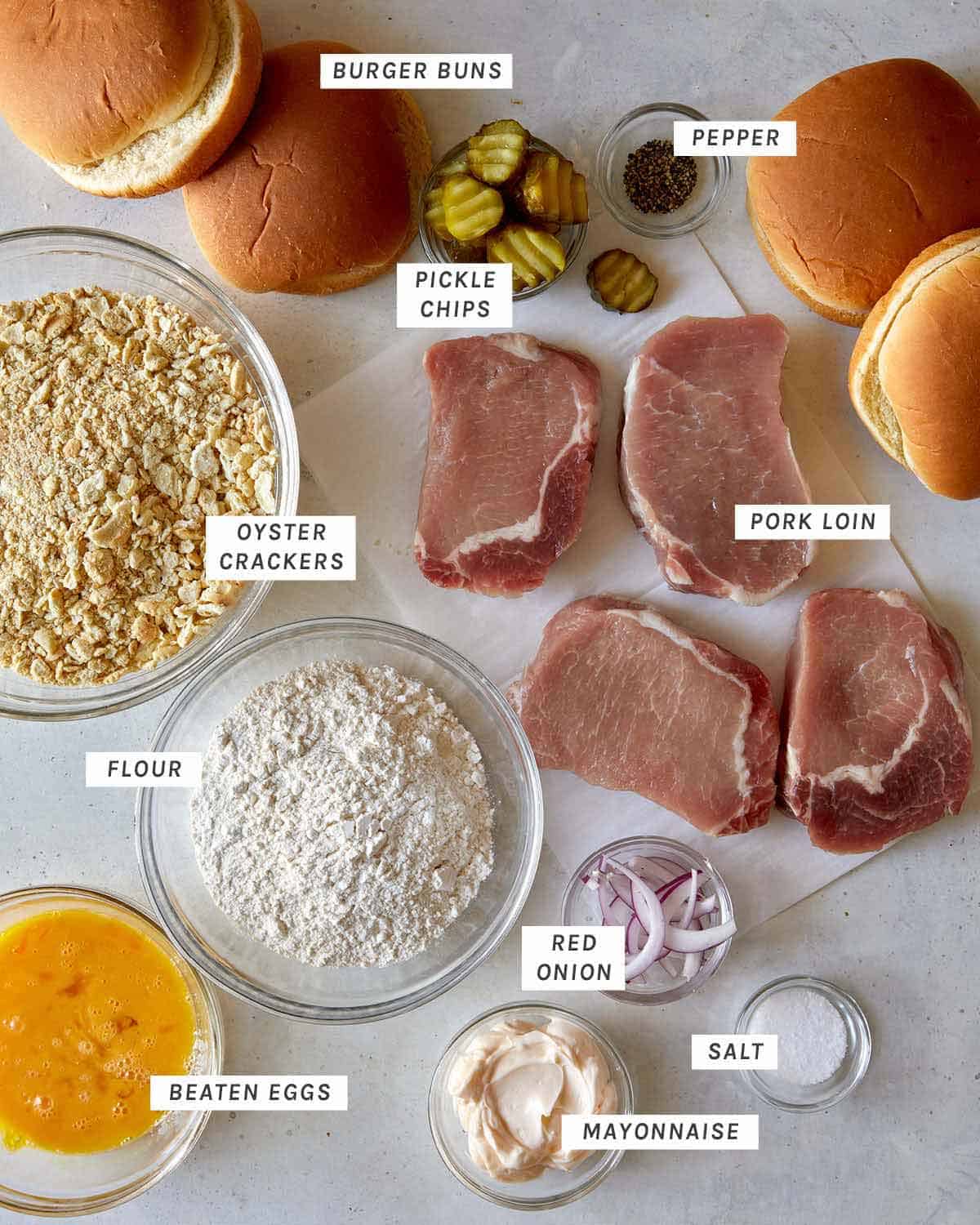 Ingredients for a pork tenderloin sandwich shot overhead.