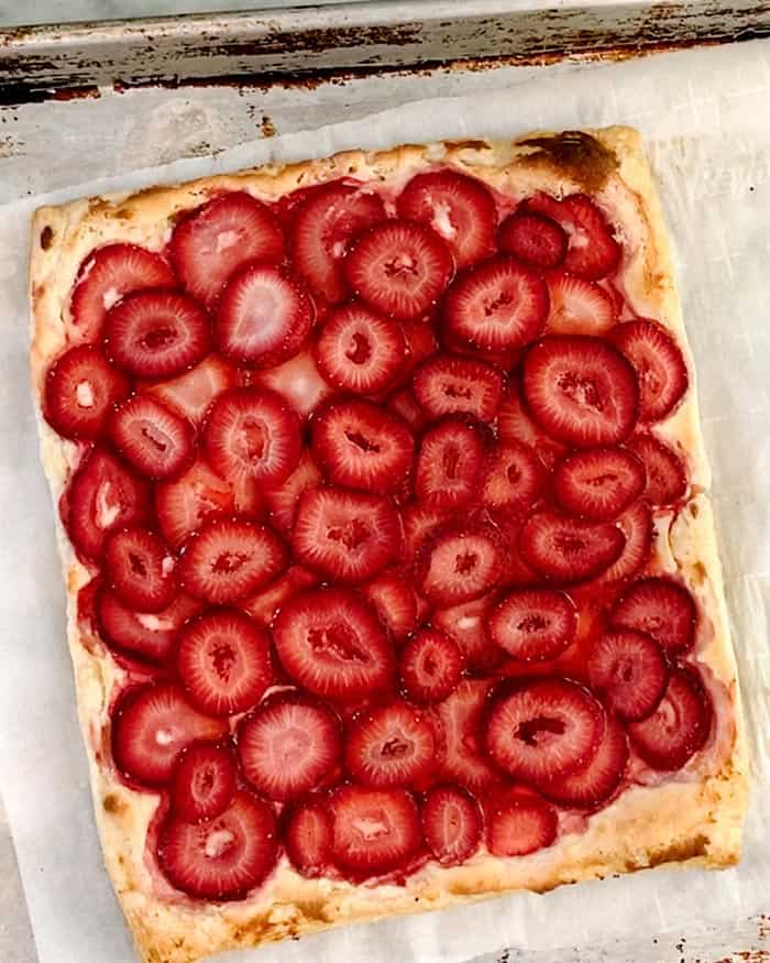 A simple strawberry tart out of the oven baked. 