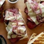 Grilled open face sandwich with tri-tip, cheese and onion.