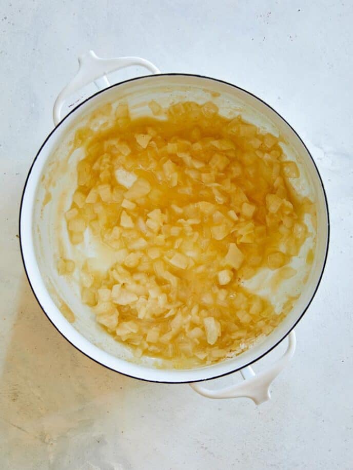 Combined melted butter and flour in a stock pot to make broccoli cheddar soup.