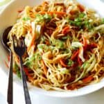 A close up of Chow Mein Noodles being served on a platter.