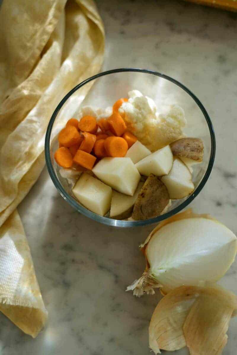 A tupperware full of leftover random pieces of vegetables.