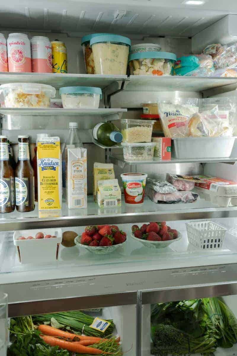 A view of the inside of an organized refrigerator.