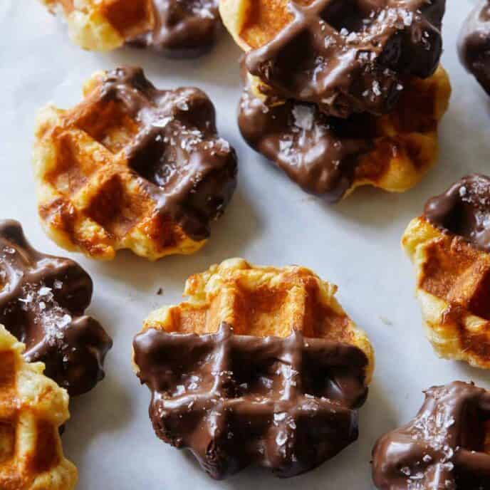 Salted Chocolate Liege Waffles spread out on a surface.