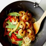 Singapore noodles in a wok ready to be served.