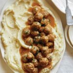 Mini Swedish Meatballs recipe on a plate with mashed potatoes.