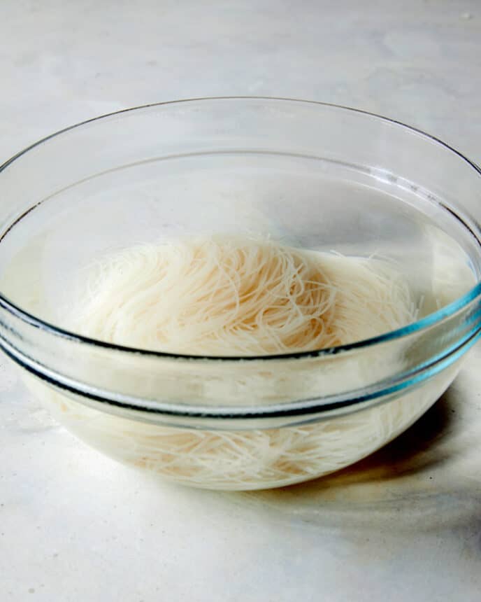 Soak vermicelli noodles in hot water for 5 to 6 minutes. 