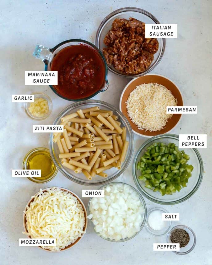Baked Ziti ingredients laid out and labeled on a kitchen counter.