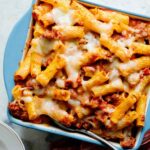 Baked ziti in a casserole dish close up.