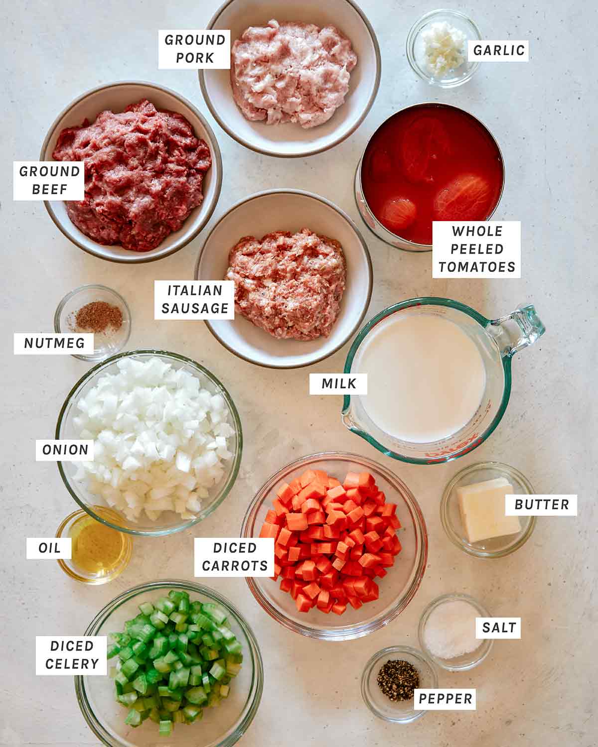 Bolognese sauce ingredients all laid out on a kitchen counter.