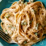 Browned Butter fettuccine alfredo on a plate with a fork.