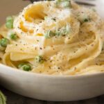 Browned Butter fettuccine alfredo in a bowl twisted together.