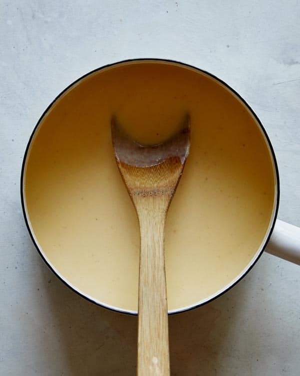 Cheese sauce in a stock pot to make cauliflower mac and cheese. 