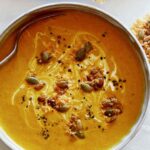 Close up on a bowl of Creamy Pumpkin Soup.