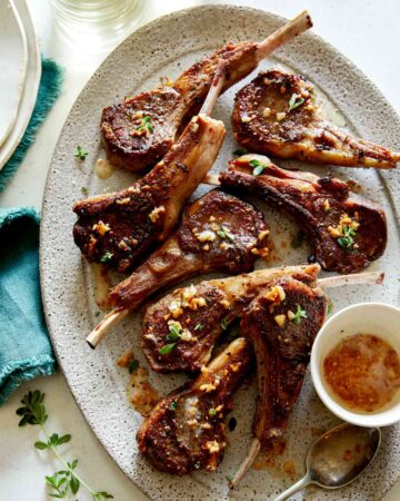 Garlic Butter Lamb Chops on a platter, part of our Christmas Dinner Ideas.