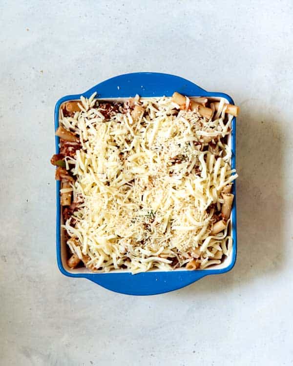 Baked ziti in a baking dish ready for the oven.