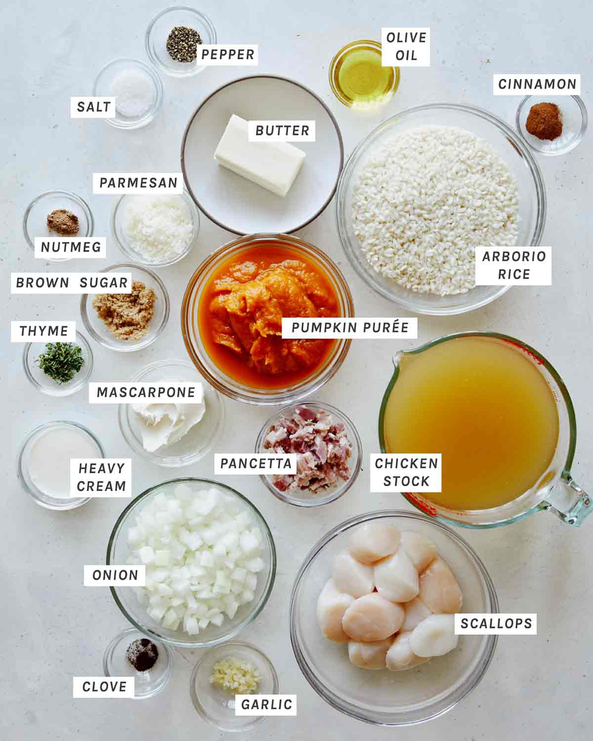 Ingredients for Pumpkin Risotto with scallops recipe on a kitchen counter. 