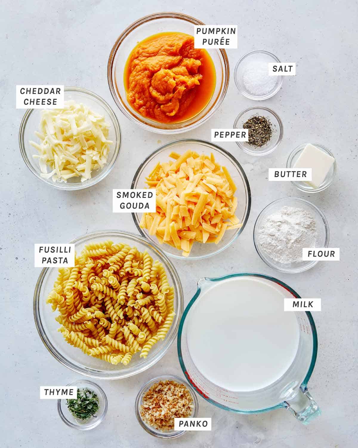 Ingredients for Pumpkin Mac and Cheese all laid out on a kitchen counter. 