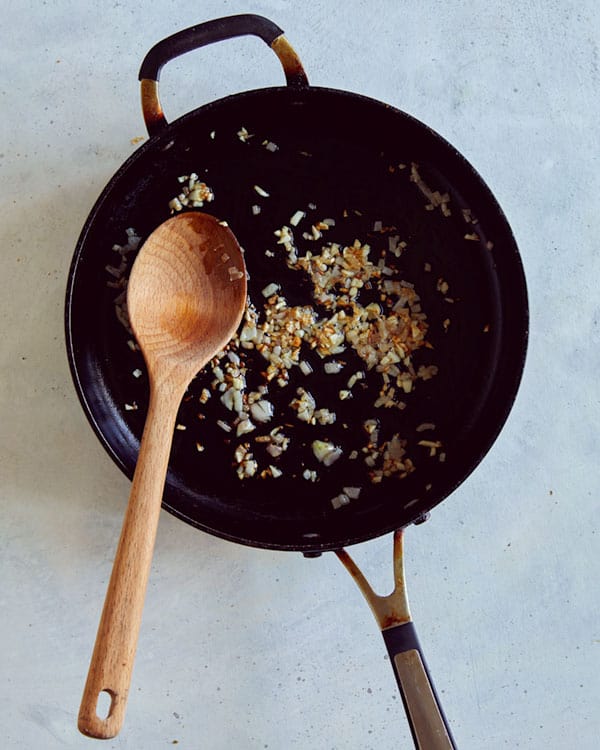 Sautéd garlic and shallots in a skillet.