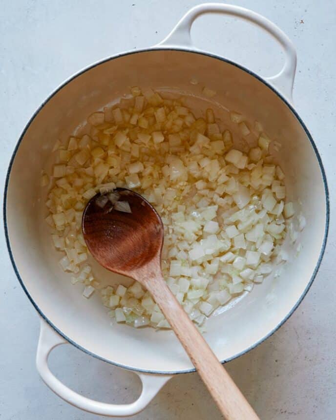 Sautéd onion and garlic in a pot.