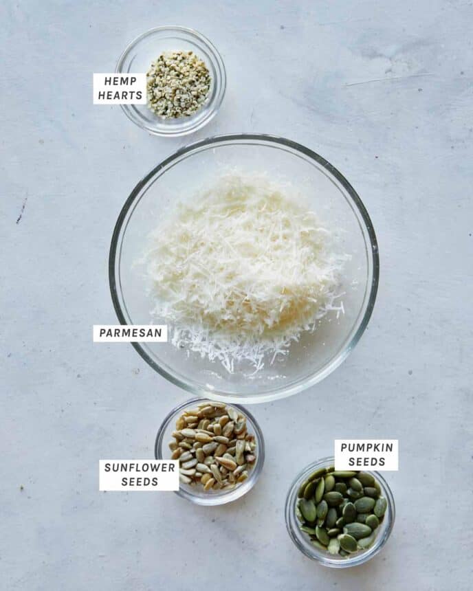 Ingredients to make our Seeded Parmesan Crisps to go with our Creamy Pumpkin Soup all laid out on a kitchen counter.