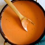 A bowl of vodka sauce pasta with a fork.