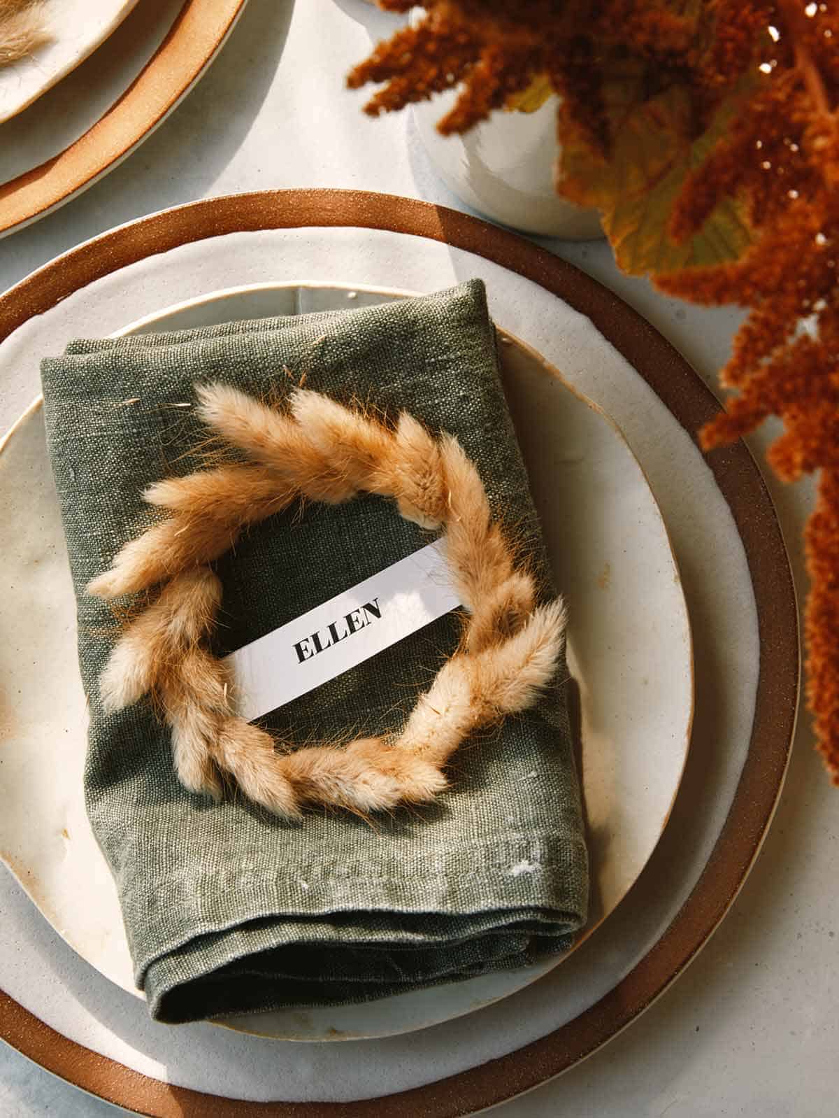 Mini Wreath Place cards DIY on a plate for a special occasion.