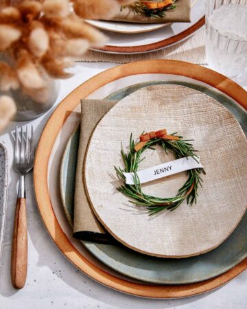 Rosemary Wreath Place Card on a plate in a table setting.