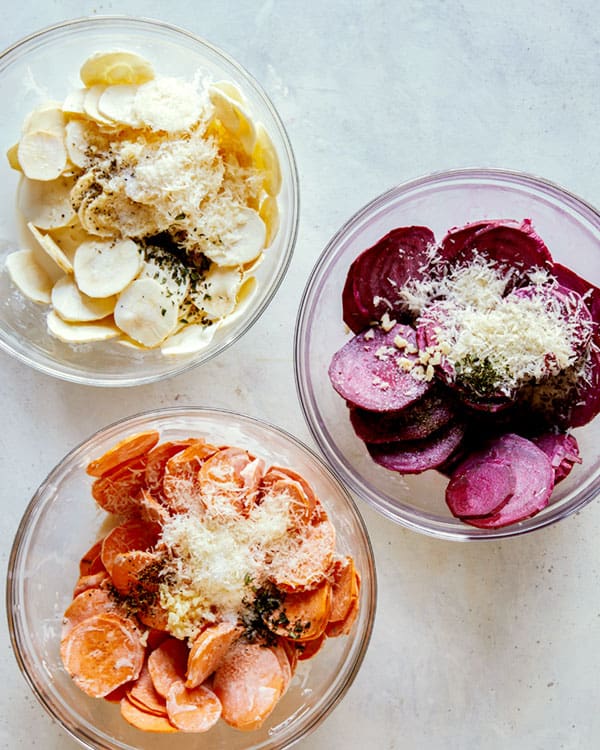 Bowls of root vegetables with cream and cheese.