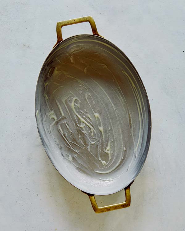 A casserole dish greased with butter.