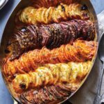 Close up on a baking dish full of Cheesy Root Vegetable Gratin.