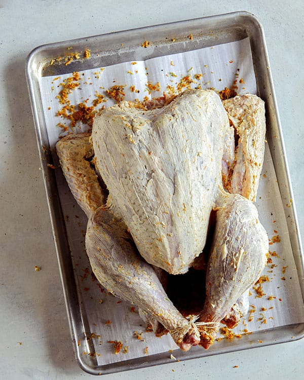 Butter rubbed on a raw turkey.