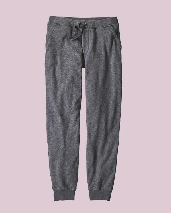 Gray sweat pants on a pink background. 