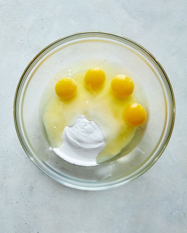 Eggs and sugar in a heatproof bowl.