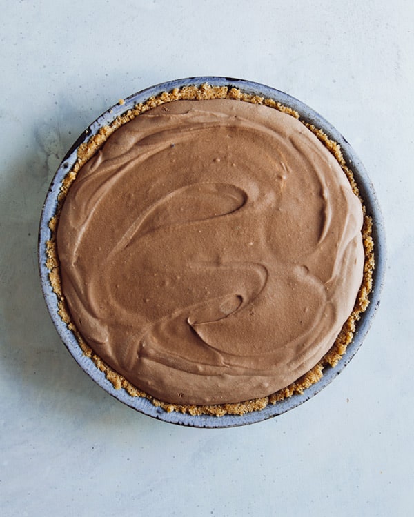 A freshly set french silk pie on a kitchen counter.