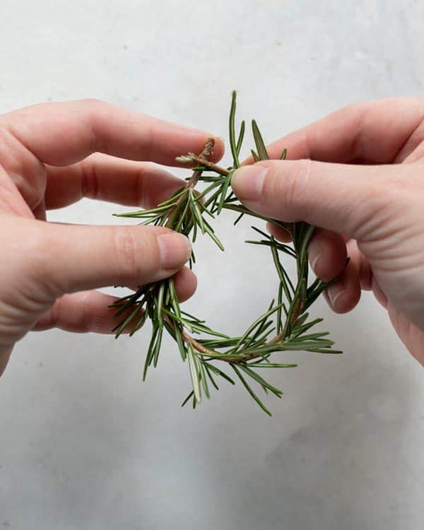 Making a rosemary wreath.