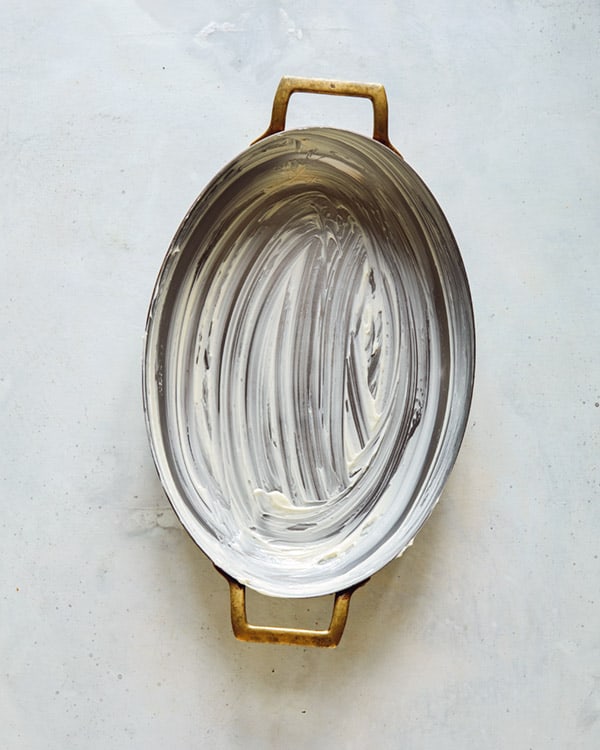 A baking dish coated with butter.