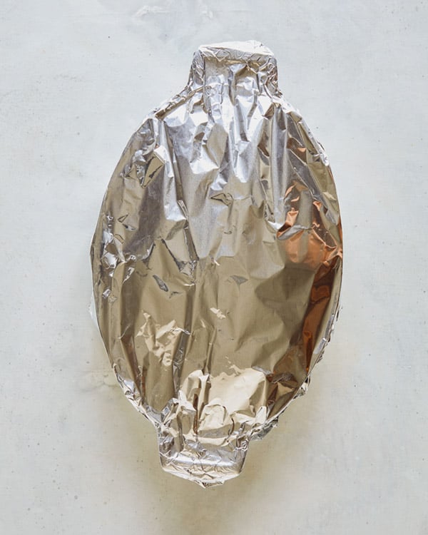 A baking dish with foil on top.