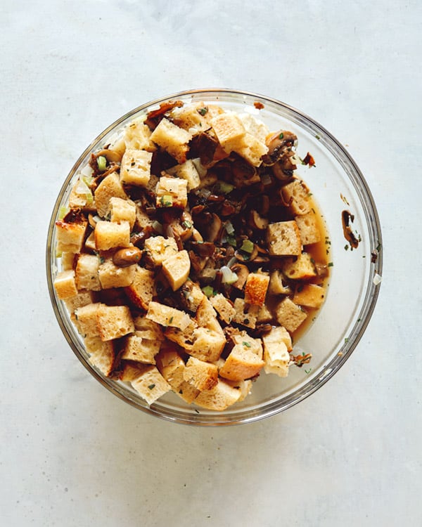 A bowl of stuffing on a kitchen counter. 