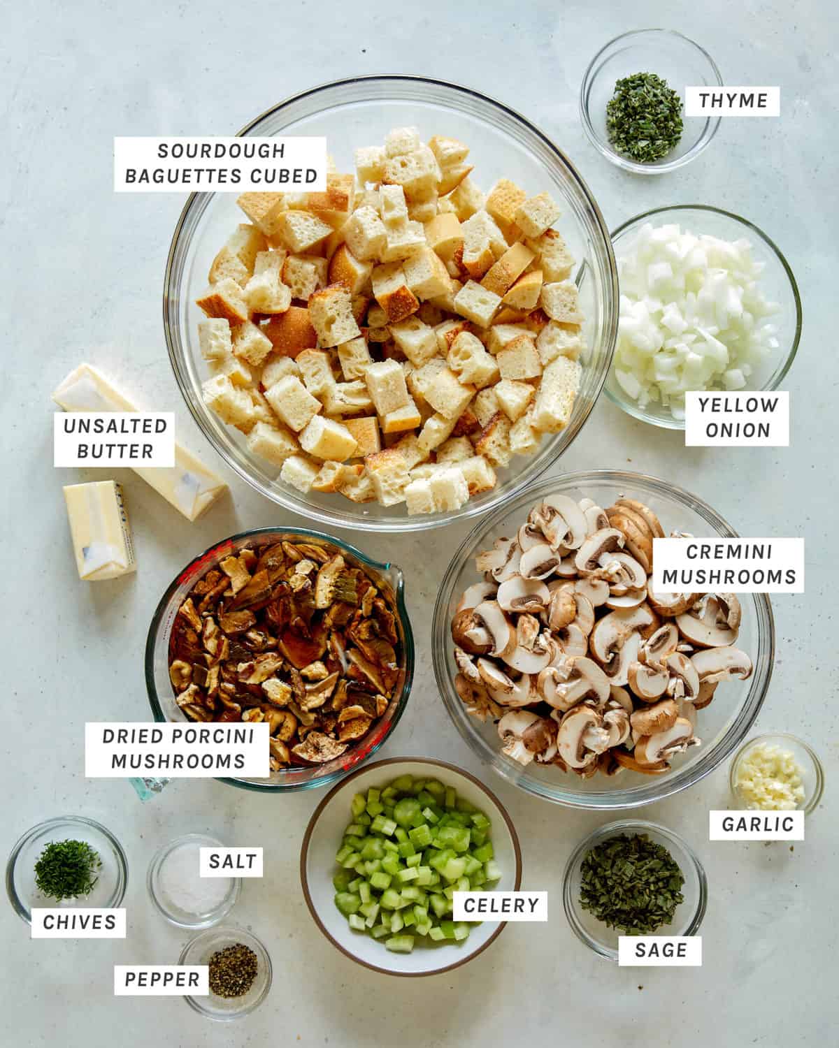 Ingredients for mushroom and sage stuffing on a kitchen counter.