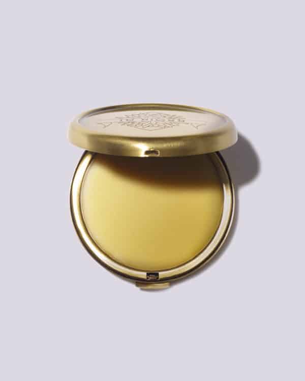 A compact of solid perfume.  