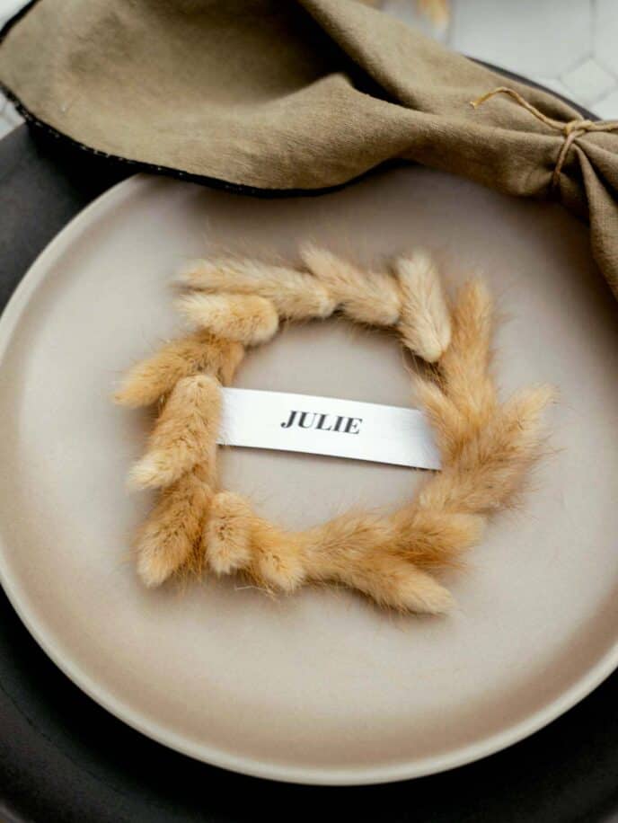 Mini wreath place card on a plate. 