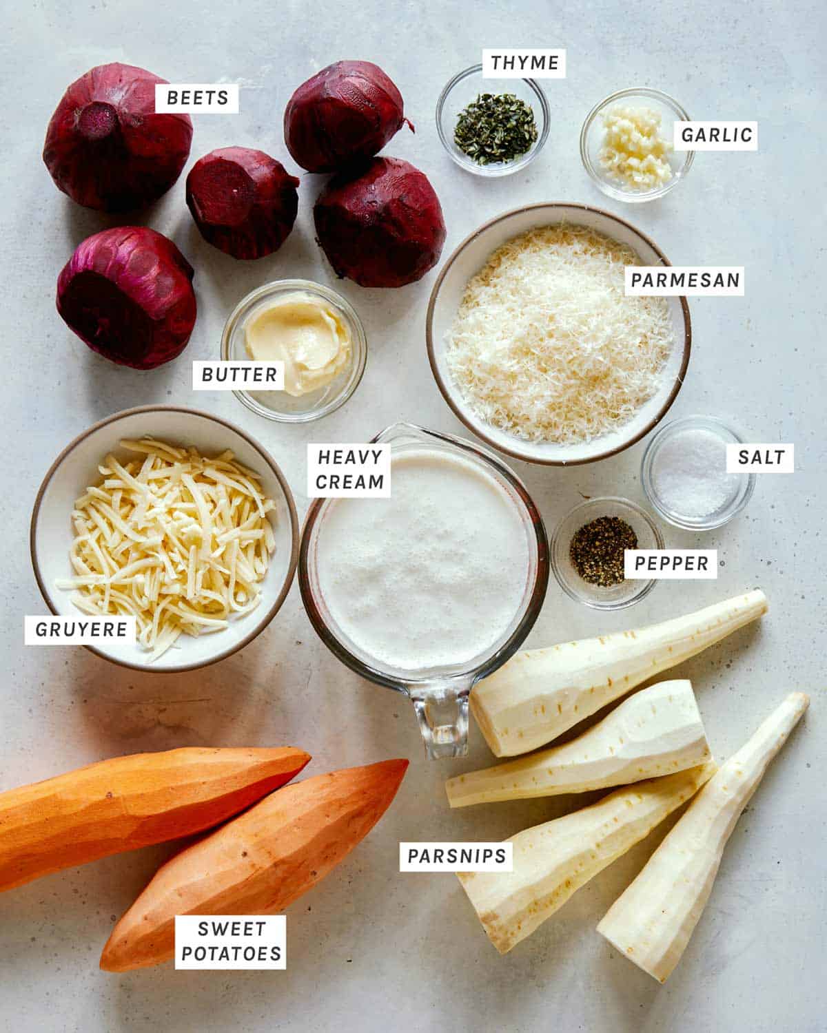 Ingredients for our Cheesy Root Vegetable Gratin on a kitchen counter. 