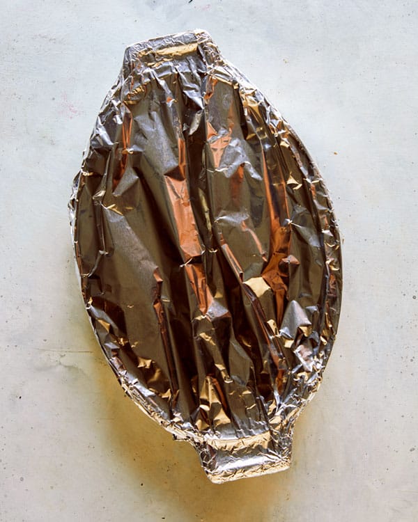 A baking dish covered with tin foil to go into the oven.