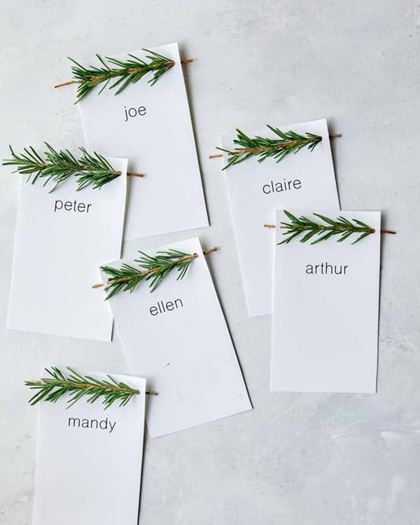 Rosemary Sprig Place Cards laid out on a surface.