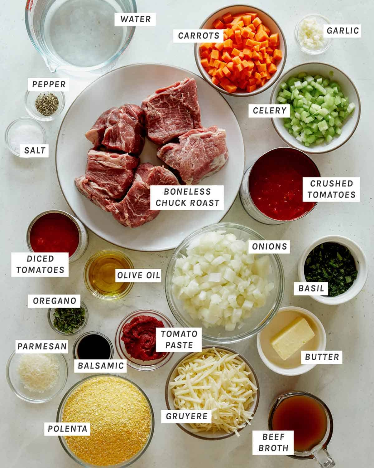 Ingredients in beef ragu all laid out on a kitchen counter. 