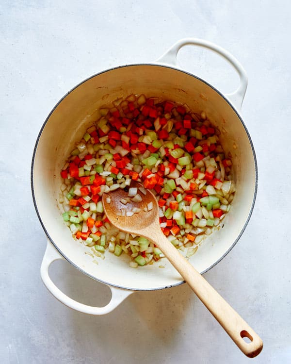 Saute carrots and celery in a stock pot.