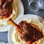 Braised lamb shanks over mashed potatoes.