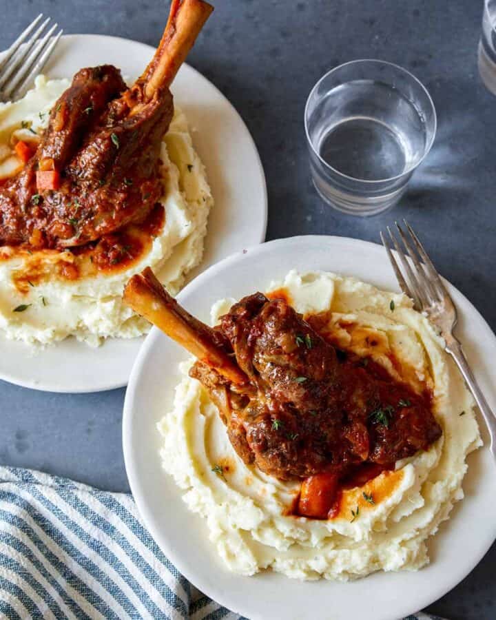 Braised lamb shanks over mashed potatoes.